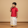 tamil boy wearing tamil traditional wear silk shirt and vesti eating sugarcane